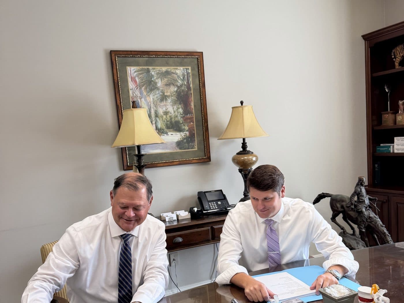 Erik Tadda and Rick Tadda reviewing documents in the firm’s Baton Rouge office