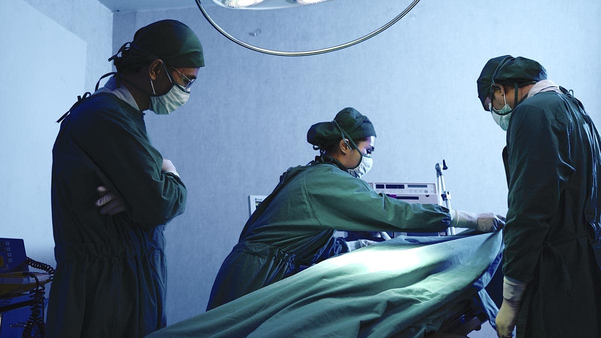 Surgeons at work in a hospital operating room